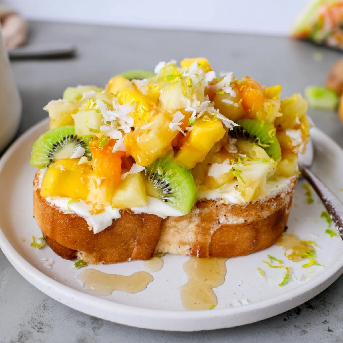 Creamy Yogurt-Custard Toast topped with vibrant tropical fruits for a refreshing breakfast.  