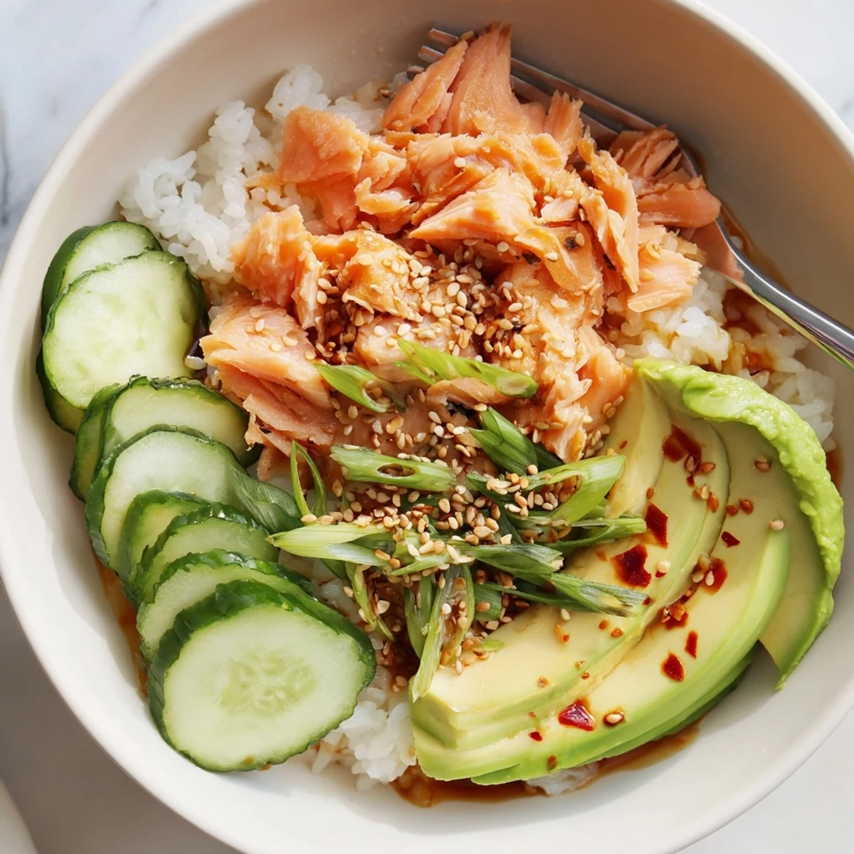 Revitalize your leftovers with this delicious Leftover Salmon & Rice Bowl, topped beautifully.  