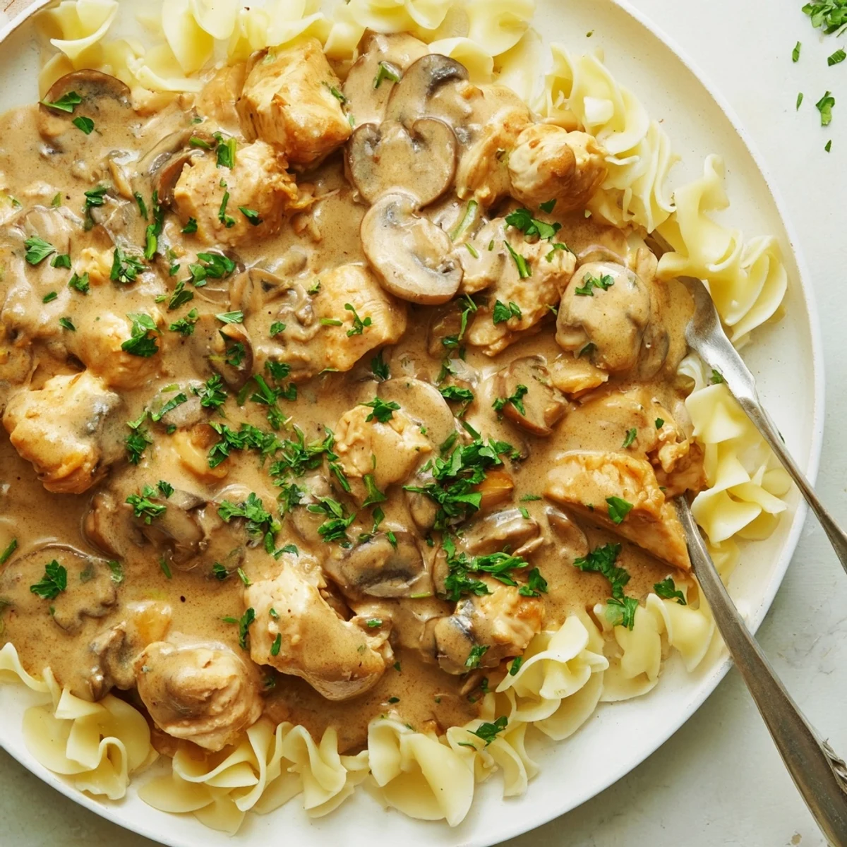Delicious Creamy Chicken Stroganoff featuring a creamy sauce and sautéed mushrooms, ideal comfort food.