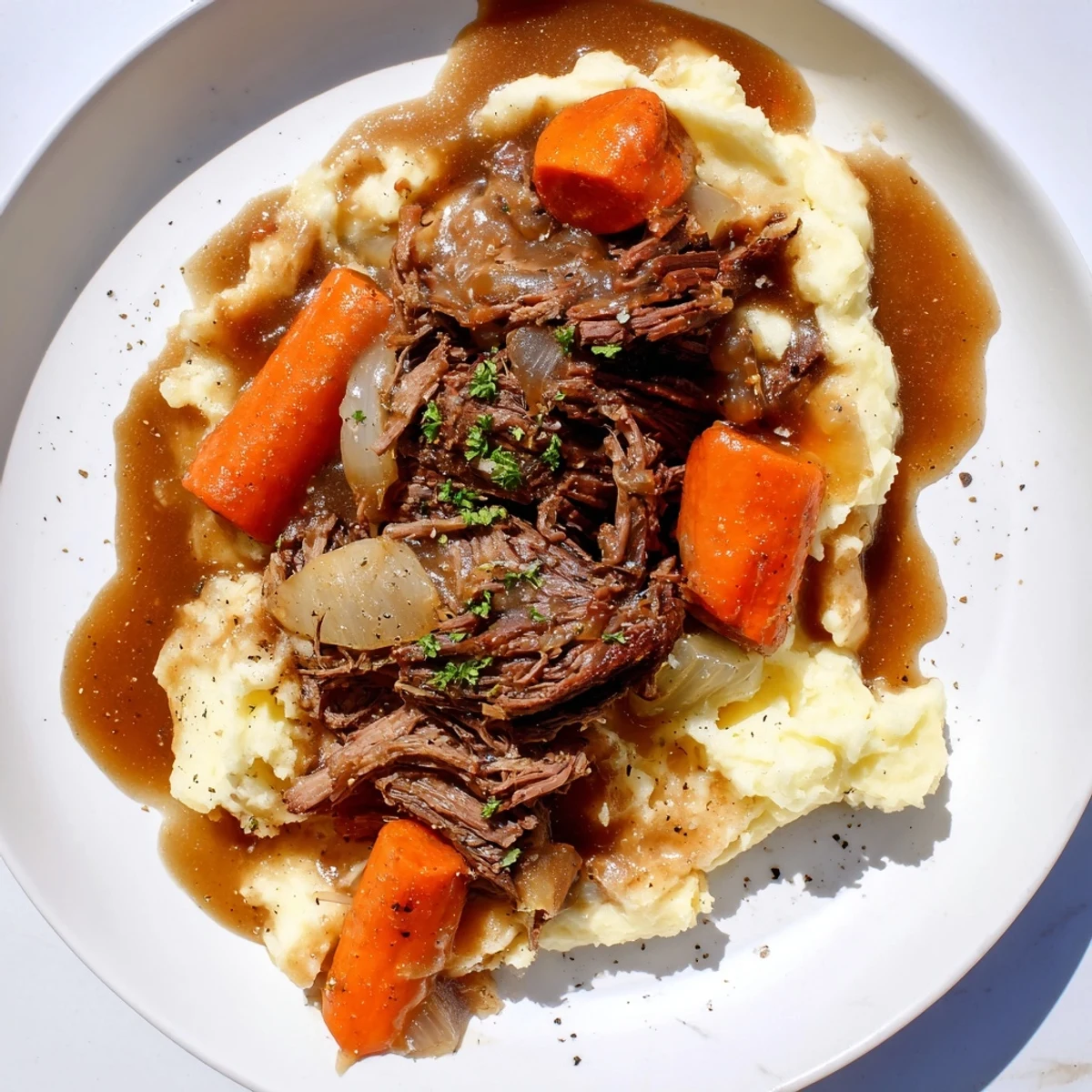 A hearty helping of Slow Cooker Pot Roast showcased, with fall-apart beef and delicious vegetables.