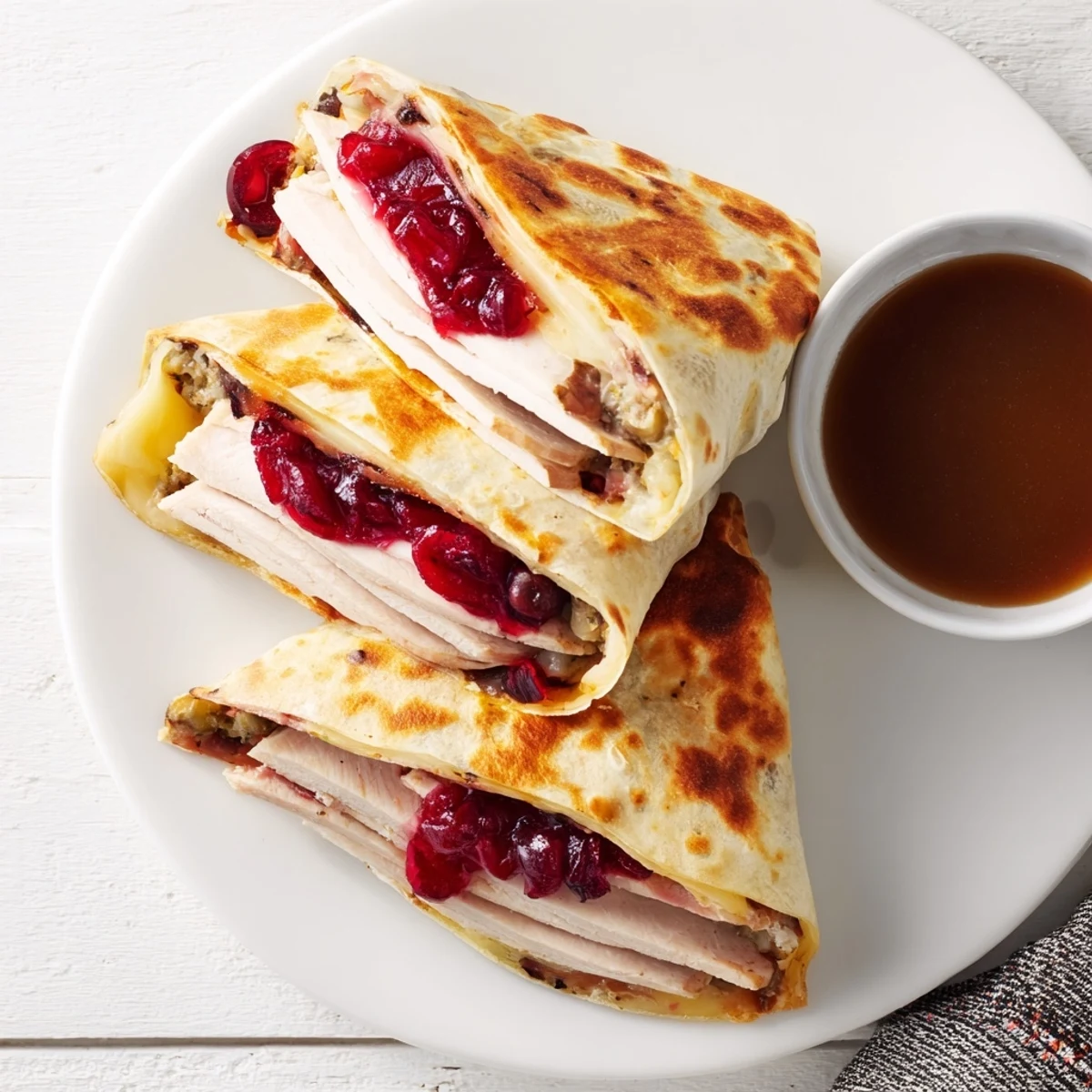 Warm Turkey, Stuffing & Cranberry Leftovers Tortilla Wrap, with cranberry peeking through for a festive flavor.