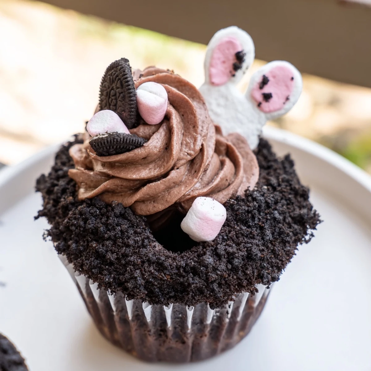 Bunny Burrow Cupcake Tray: Adorable chocolate cupcakes with creamy buttercream “burrows” and cute fondant bunny feet.