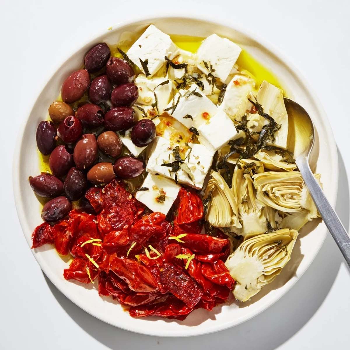 A beautifully arranged Black Olive and Sun-Dried Tomato platter, ready to be enjoyed with friends.