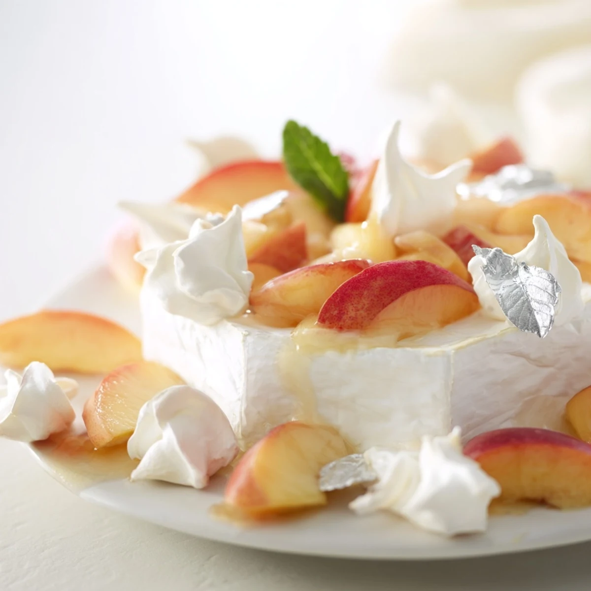 Heavenly The Pearly Gates cheese board features creamy brie, crisp meringue, and juicy white peaches.