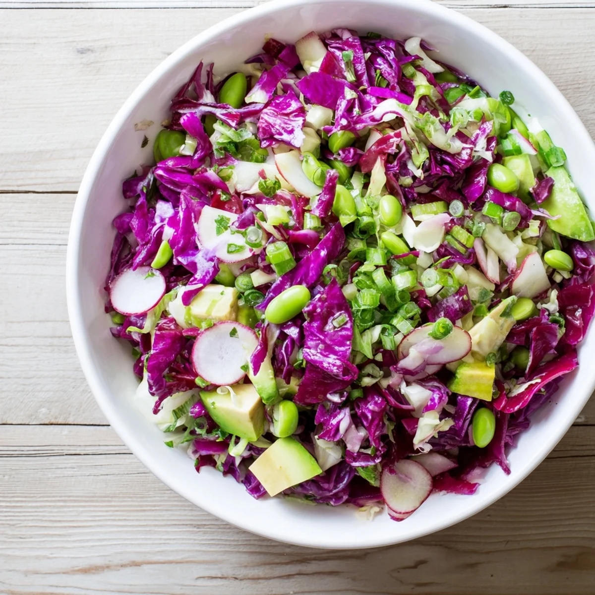 Freshly made Green Goddess Detox Cabbage Salad; imagine the satisfying crunch of each vegetable bite.