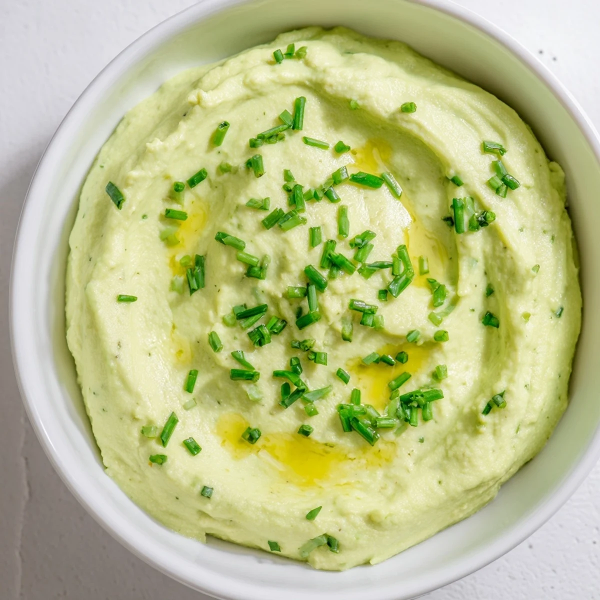 Vivid image of Avocado Cottage Cheese Dip, a healthy and easy spread with chives and creamy texture.