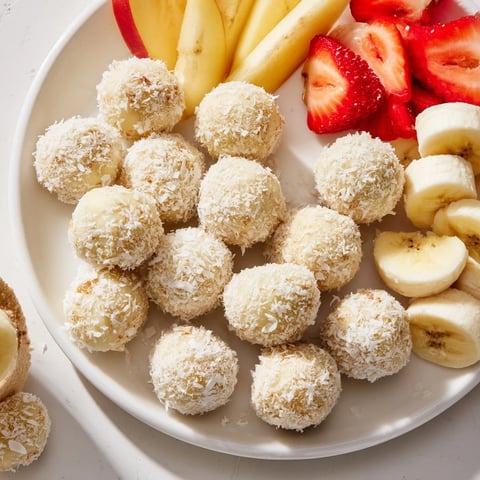 Creamy Marshmallow Snowball Dip Platter, served with fresh fruit and pretzels for dipping.