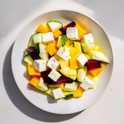 Geometric Cube Salad: Colorful cubes of mango, avocado, and beets arranged artfully for a refreshing appetizer.
