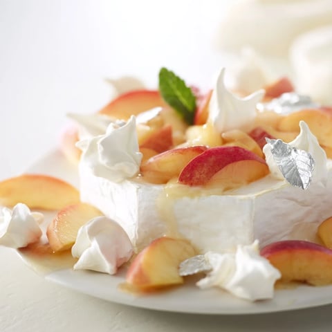 Heavenly The Pearly Gates cheese board features creamy brie, crisp meringue, and juicy white peaches.