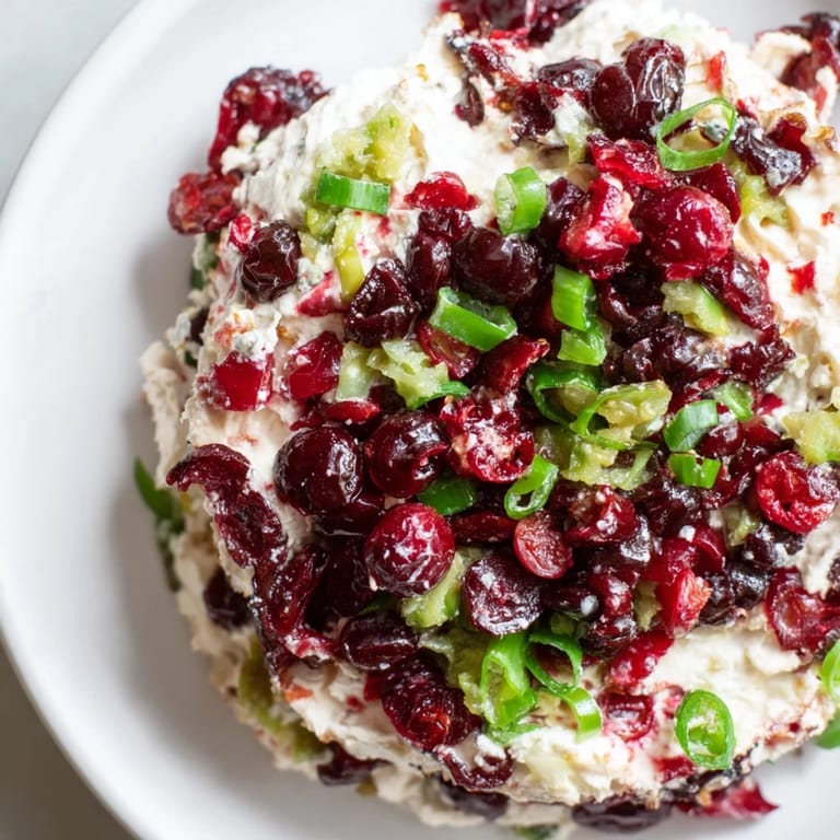 Creamy texture meets zesty flavors in this Spicy Ginger Cranberry Jalapeño Dip.  
