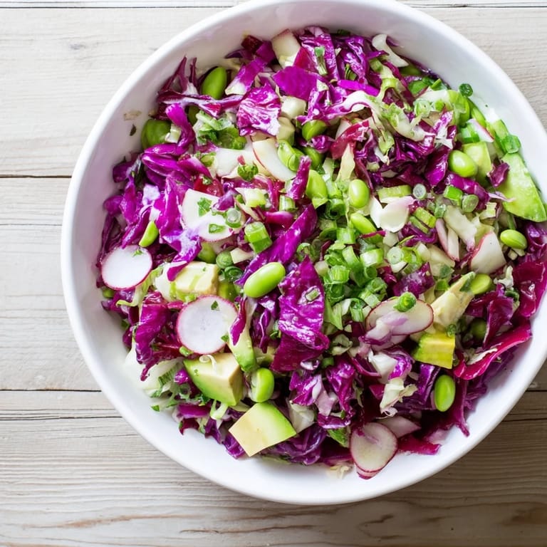 Freshly made Green Goddess Detox Cabbage Salad; imagine the satisfying crunch of each vegetable bite.
